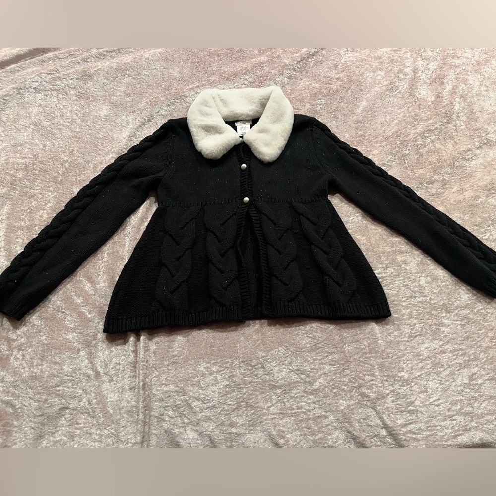 Beautiful black jacket or cardigans with some shimmer and pearl buttons.